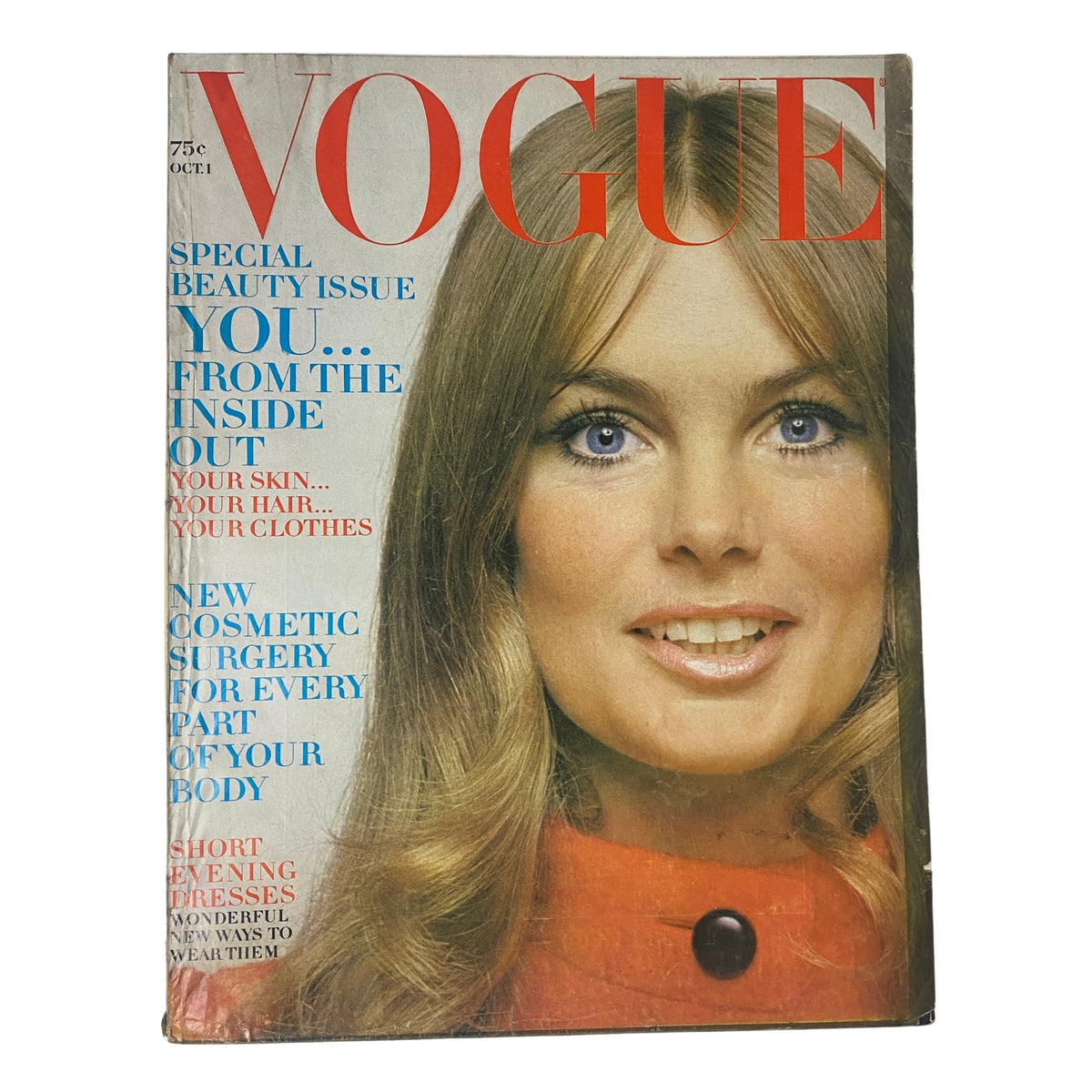 Vogue Magazine October 1, 1969 Jean Shrimpton Cover by Bert Stern featuring a stunning model with long blonde hair and blue eyes, dressed in a bold orange coat, showcasing a captivating vintage fashion aesthetic.