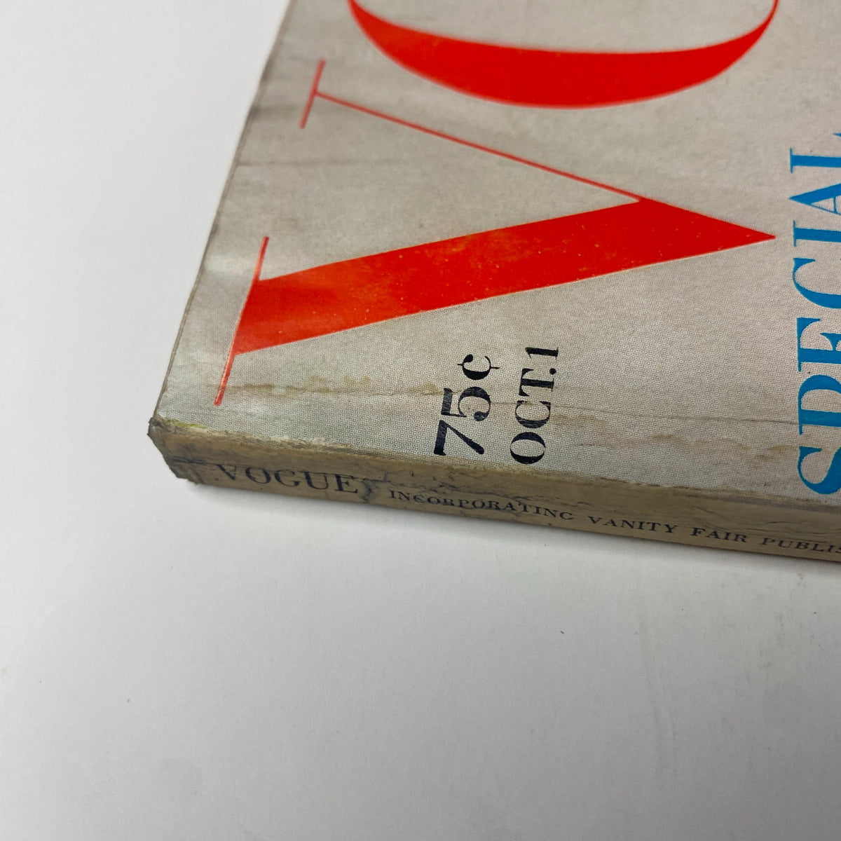Close-up of the spine of Vogue Magazine October 1, 1969 Jean Shrimpton Cover by Bert Stern, showing the magazine’s vintage wear with a price of 75 cents and the date prominently displayed.