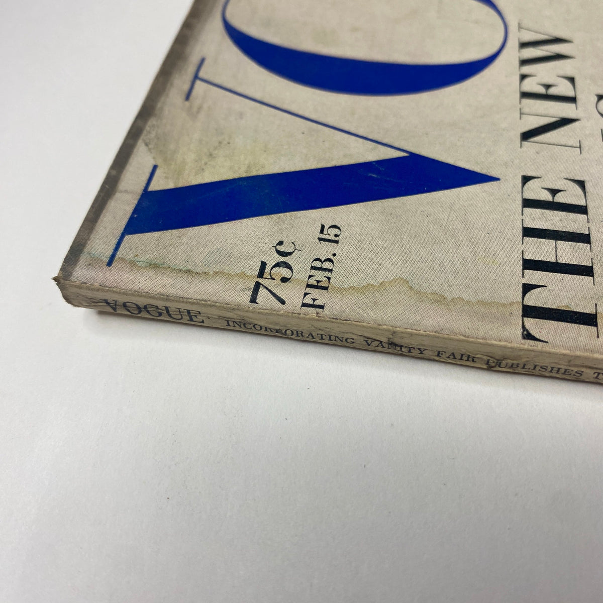 Detail of the spine of Vogue Magazine February 15, 1969 with visible wear, emphasizing its vintage character and preservation by Original Magazines.