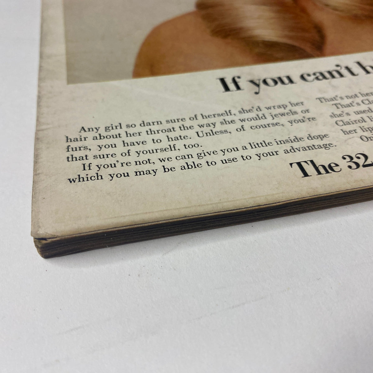 The corner of Vogue Magazine February 15, 1969, displaying wear and age with a faded edge, reflecting its vintage status and collectible nature, featuring a quote about self-assurance.