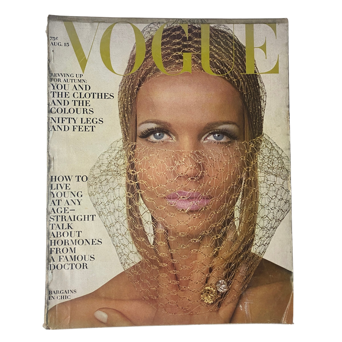 Cover of Vogue Magazine August 15, 1965 featuring Veruschka photographed by Irving Penn, showcasing mid-1960s fashion with intricate detailing.