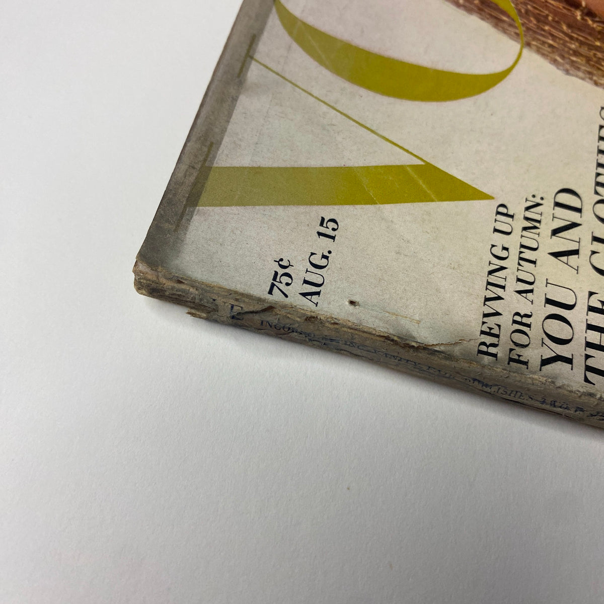Close-up view of the outer spine of Vogue Magazine August 15, 1965, revealing wear and age, reflective of its vintage condition.