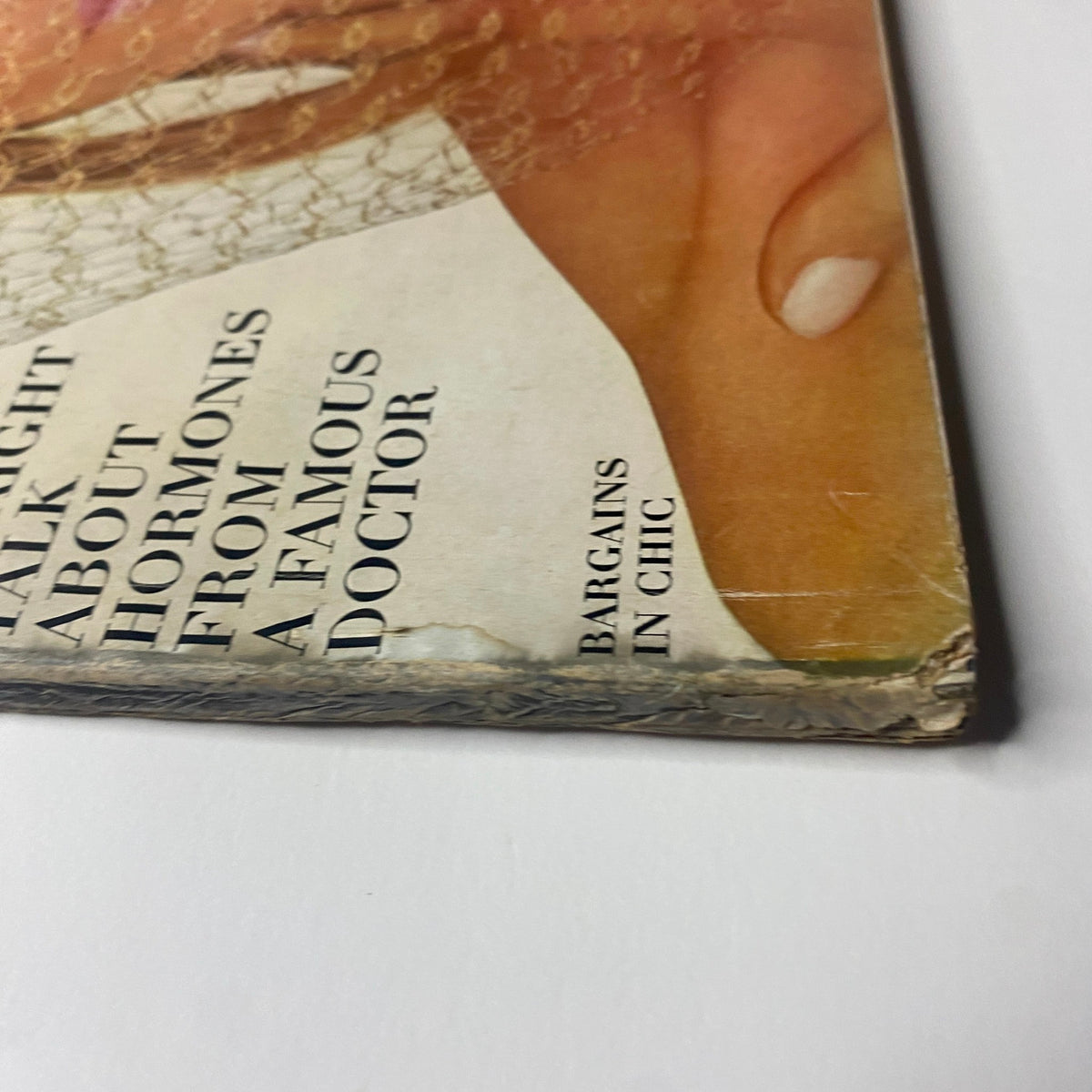 Detail of the bottom corner of Vogue Magazine August 15, 1965, showing binding wear and historical characteristics typical of vintage magazines.