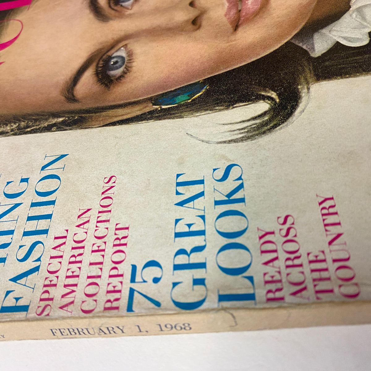 Close-up angle of the side cover of Vogue Magazine February 1, 1968, highlighting features like '75 GREAT LOOKS' and the date, showcasing its vintage charm and appeal for collectors.