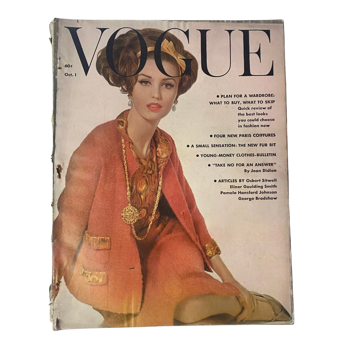 Vogue Magazine October 1, 1961 cover featuring Dorothy McGowan, photographed by Irving Penn. The cover showcases early 1960s fashion with vibrant colors and elegant styling.