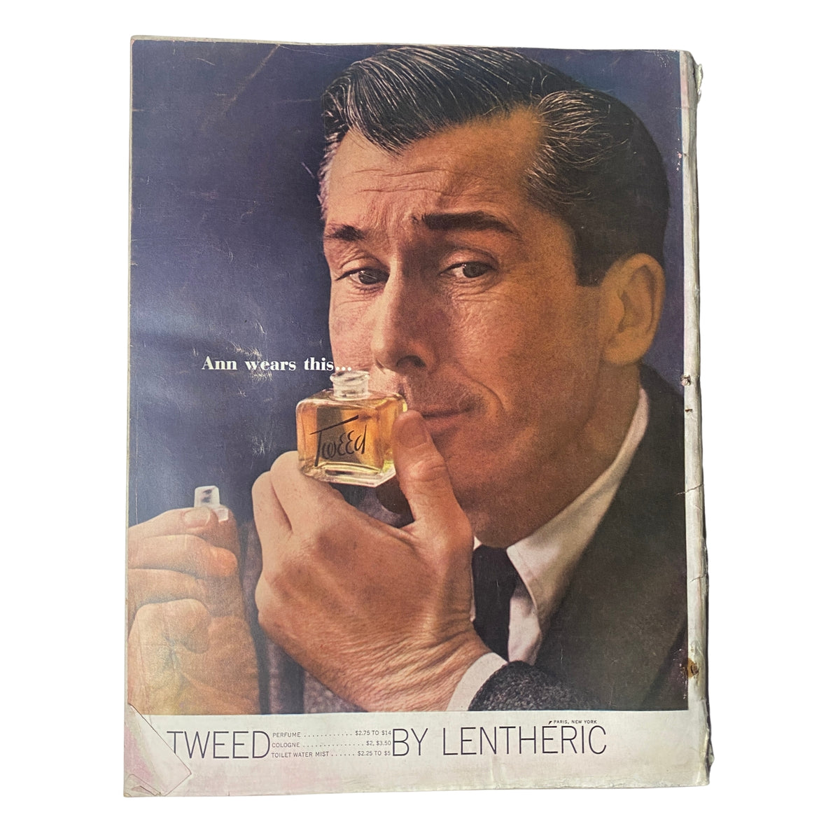 Cover page of Vogue Magazine October 1, 1961 Dorothy McGowan Cover by Irving Penn featuring a male model holding a perfume bottle, illustrating classic fashion advertising from the early 1960s.