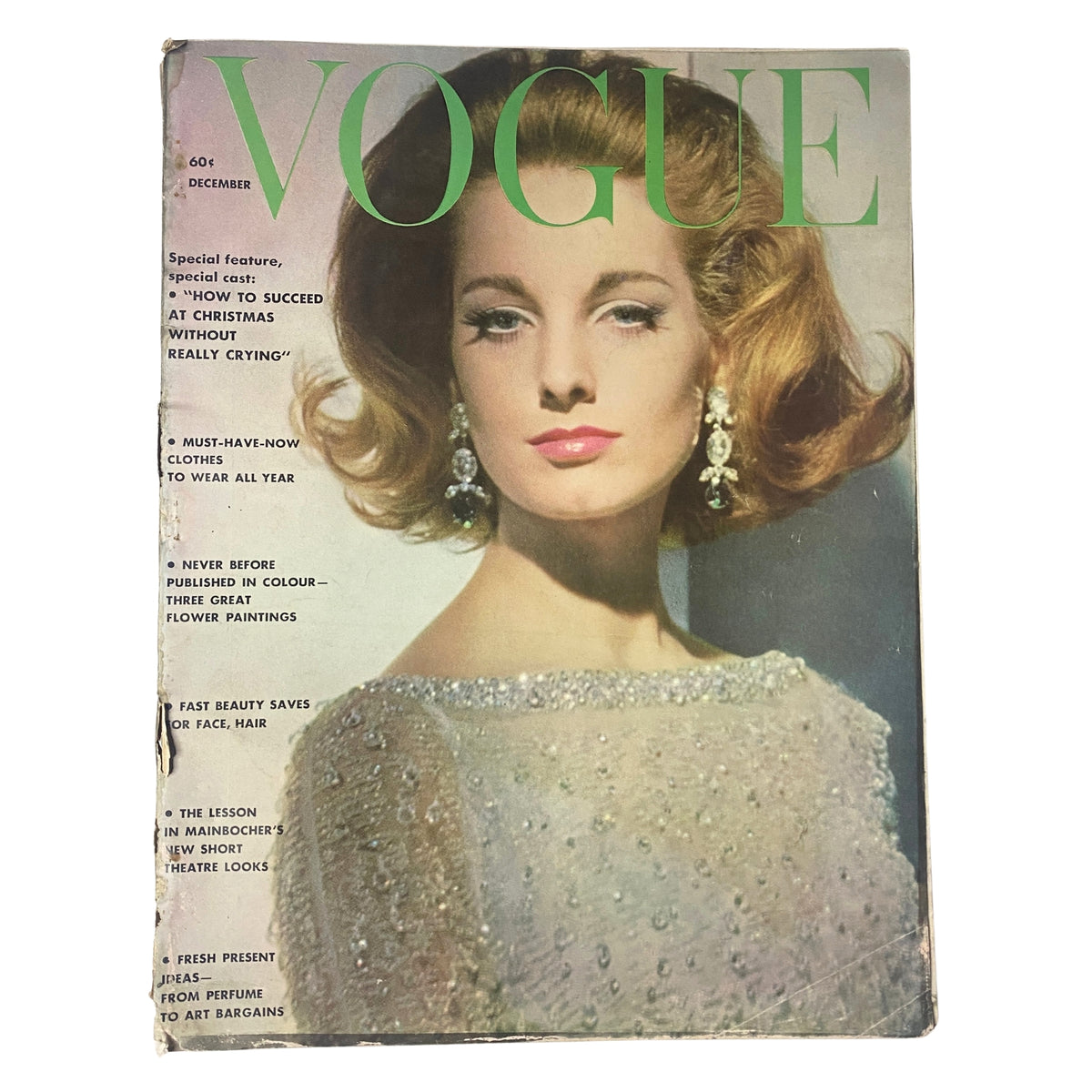 Cover of Vogue Magazine December 1961 featuring Antonia Boekestyn, photographed by Horst P. Horst, showcasing vintage holiday fashion and beauty.