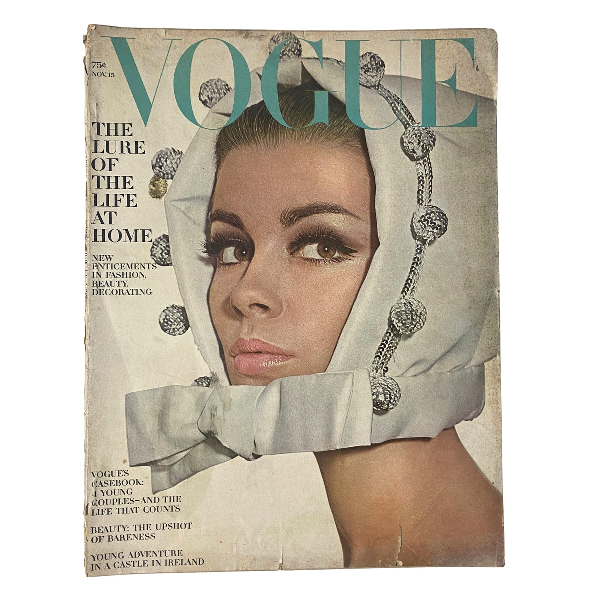 Cover of Vogue Magazine, November 15, 1964, featuring Astrid Heeren, photographed by Irving Penn. The cover showcases mid-1960s fashion and beauty trends, highlighting the sophistication of the era.