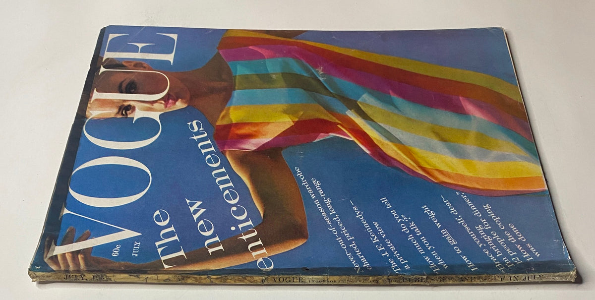 Cover of Vogue Magazine July 1961, depicting Deborah Dixon in a brightly colored striped dress, emphasizing early 1960s fashion trends and cultural aesthetics.