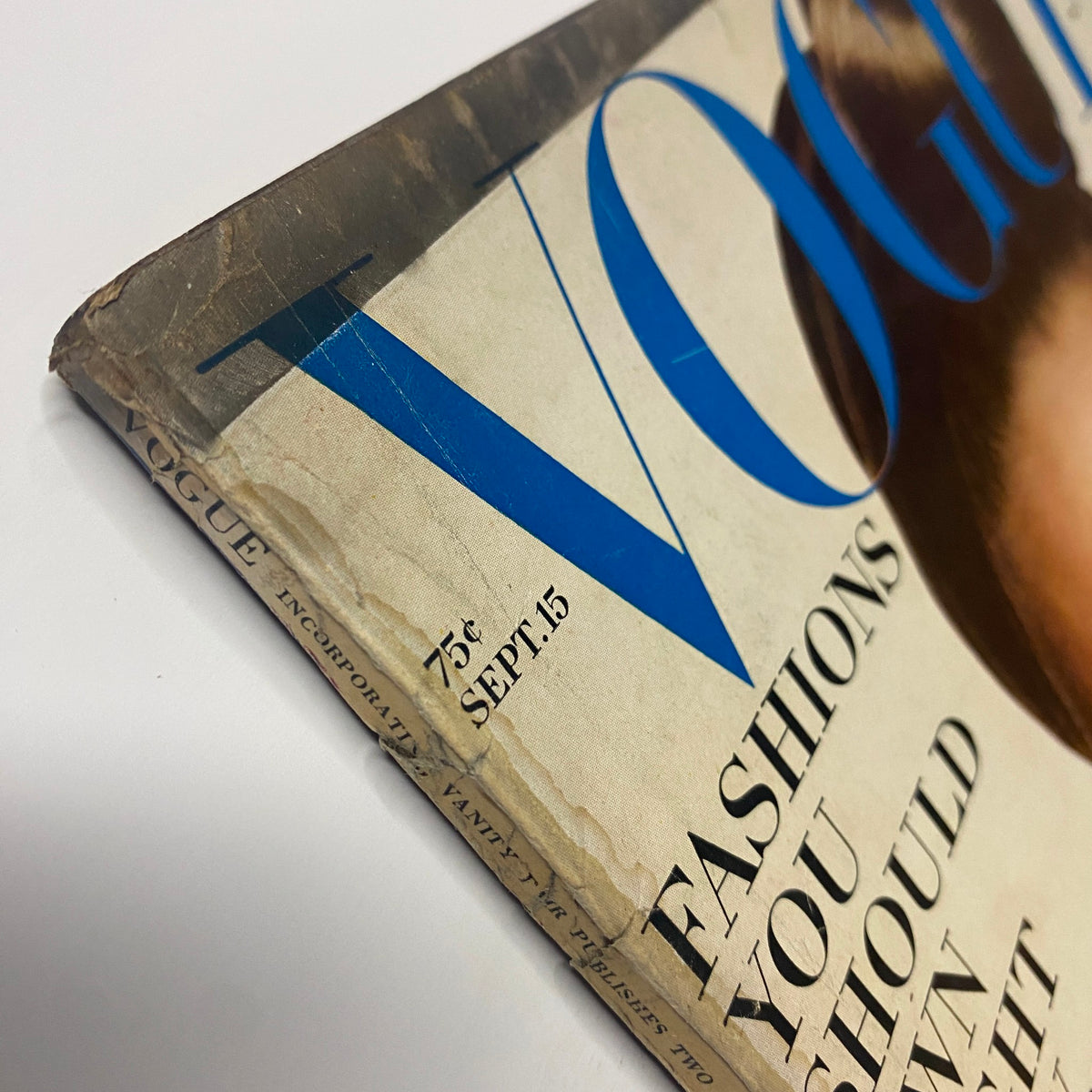 Side angle of the Vogue Magazine September 15, 1966, showing the condition of the outer spine with notable wear, featuring Brigitte Bauer's cover by Richard Avedon.
