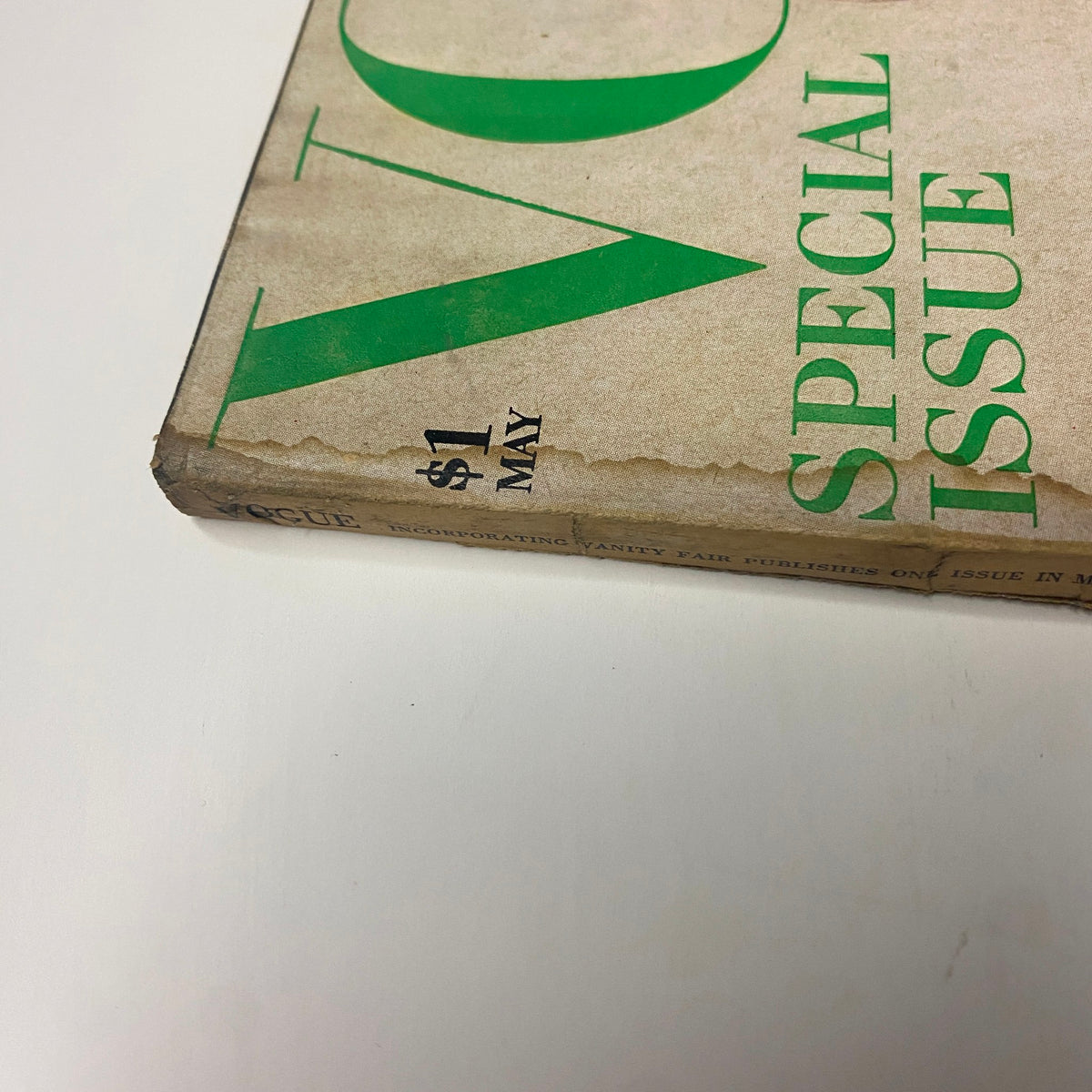 Detailed shot of the corner of Vogue Magazine May 1969 showing the title and publication details, featuring hints of wear and vintage characteristics.