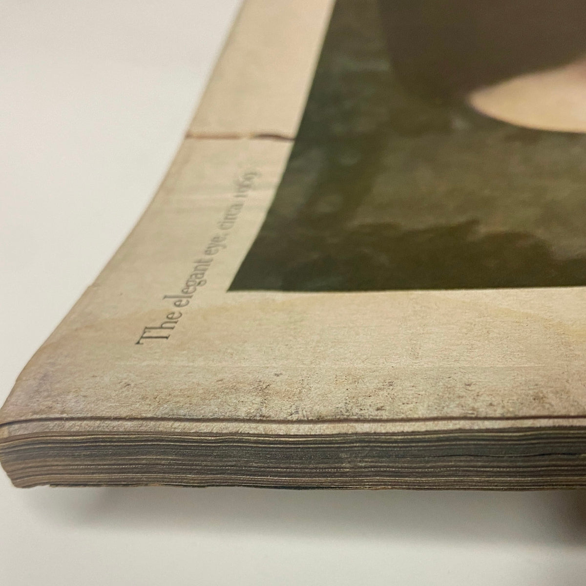 Vogue Magazine March 1, 1969 Sue Murray Cover by Irving Penn, featuring a close view of the magazine's spine, showcasing its vintage charm and aesthetic wear from the late 1960s.