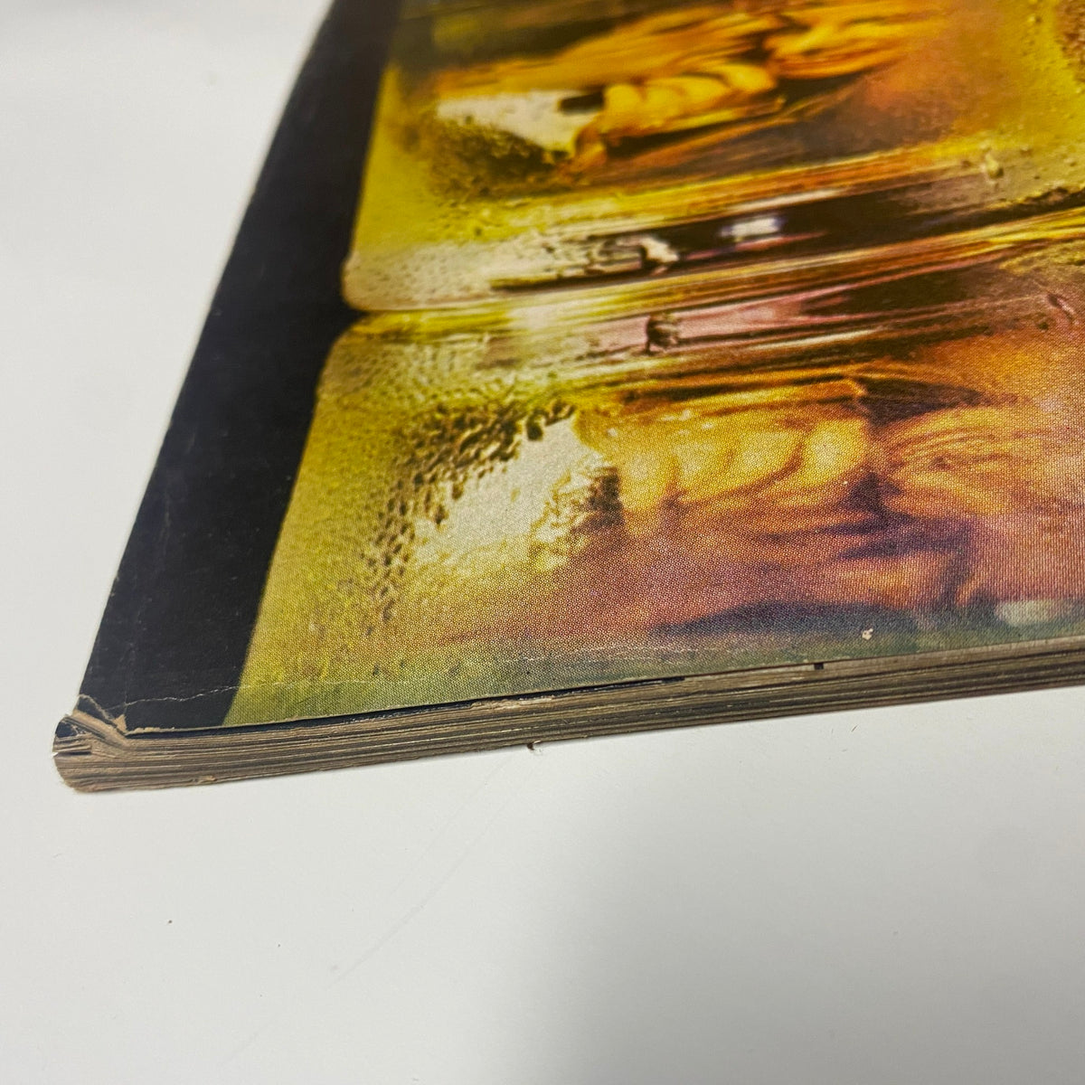 Vogue Magazine July 1968 close-up of the spine, highlighting vintage condition with wear details and archival preservation signs.