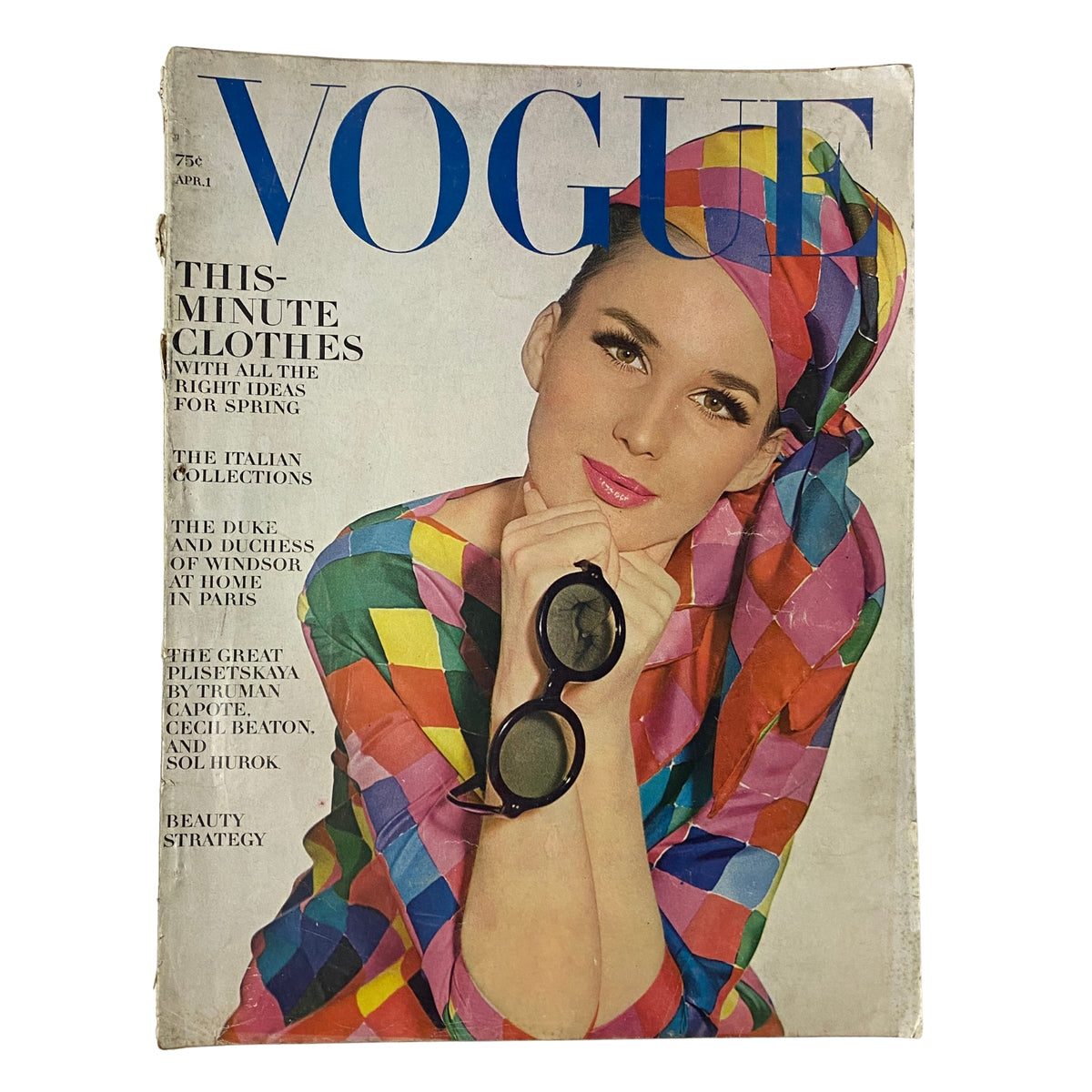Vogue Magazine April 1, 1964 featuring Brigitte Bauer on the cover, wearing a colorful patterned outfit and sunglasses, photographed by Irving Penn.