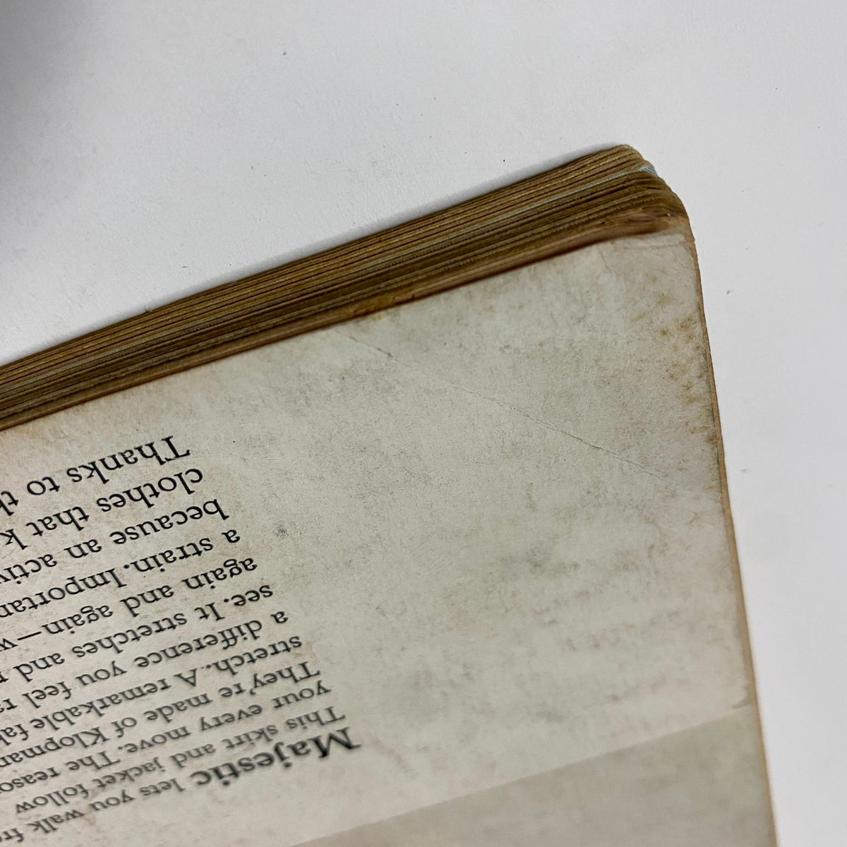 Close-up of the spine of Vogue Magazine April 1, 1964, highlighting aging characteristics and careful preservation, indicative of its vintage quality.