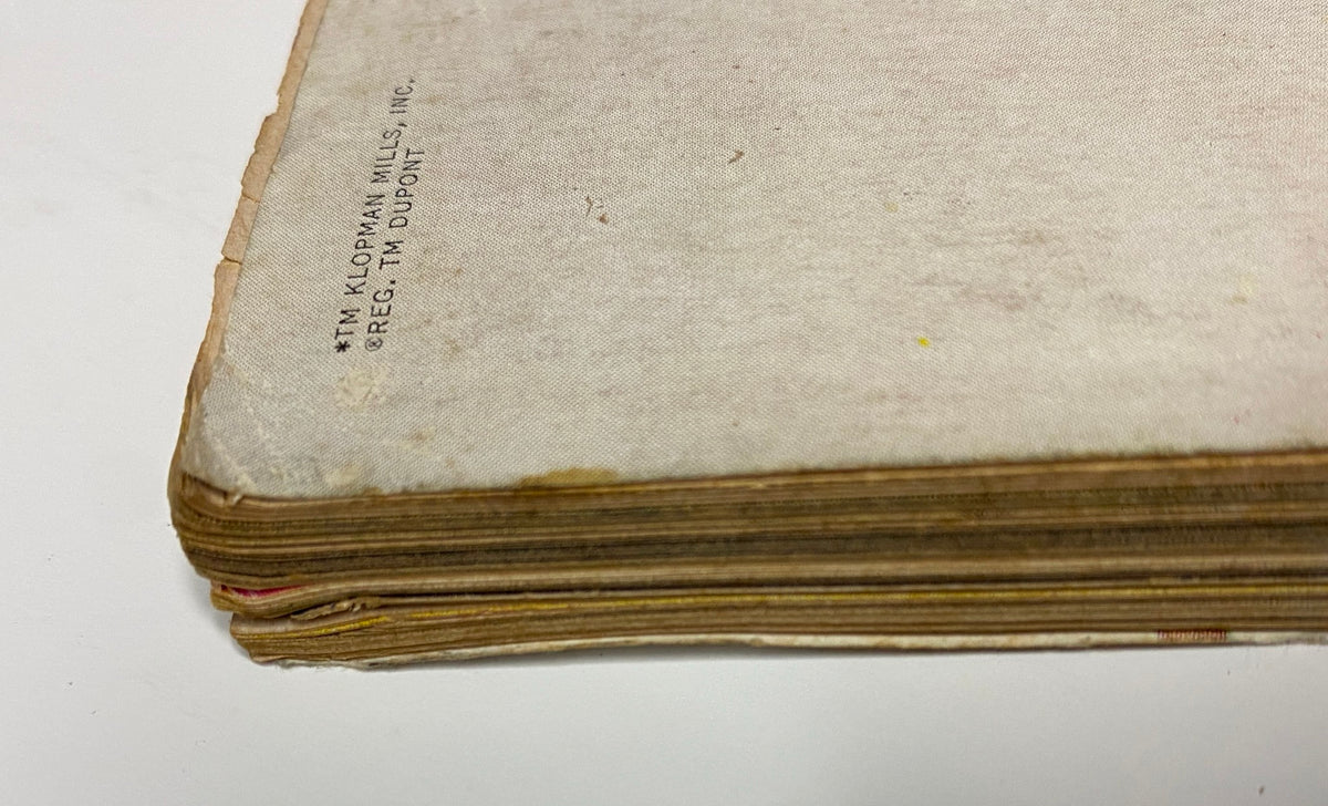 Side view of Vogue Magazine April 1, 1964, showing the well-loved edges and pages that reflect its historical significance in fashion media.