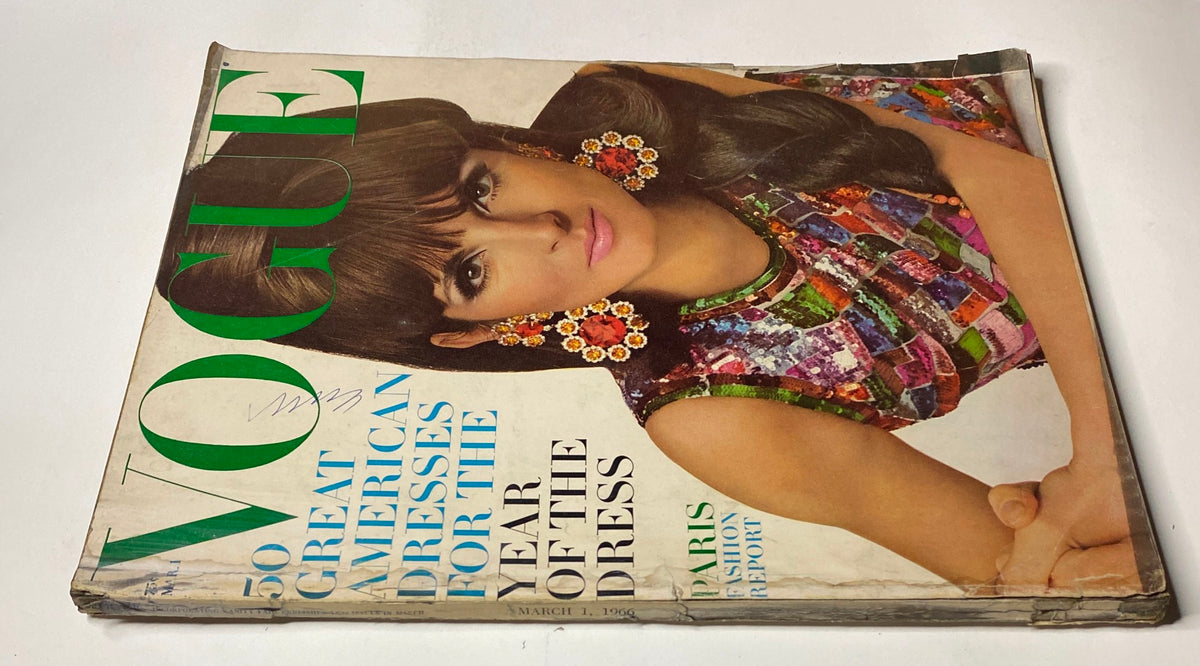 Vintage Vogue Magazine March 1, 1966 featuring Mirella Petteni on the cover, showcasing vibrant colors and sequined designs, highlighting the theme 'The Year of the Dress'.