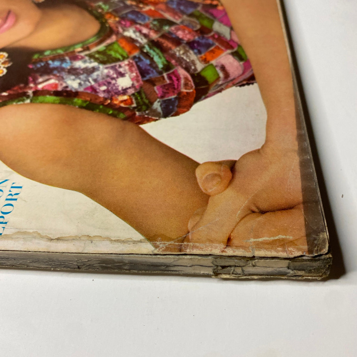Detail of the cover edge of Vintage Vogue Magazine March 1, 1966 featuring Mirella Petteni, showcasing mild damage indicative of its vintage status.