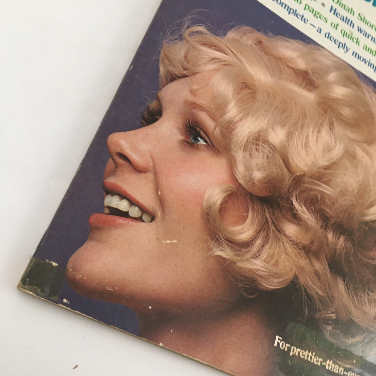 Side profile of a smiling woman with blonde, curly hair on the cover of Good Housekeeping Magazine August 1972, illustrating themes of beauty and love.