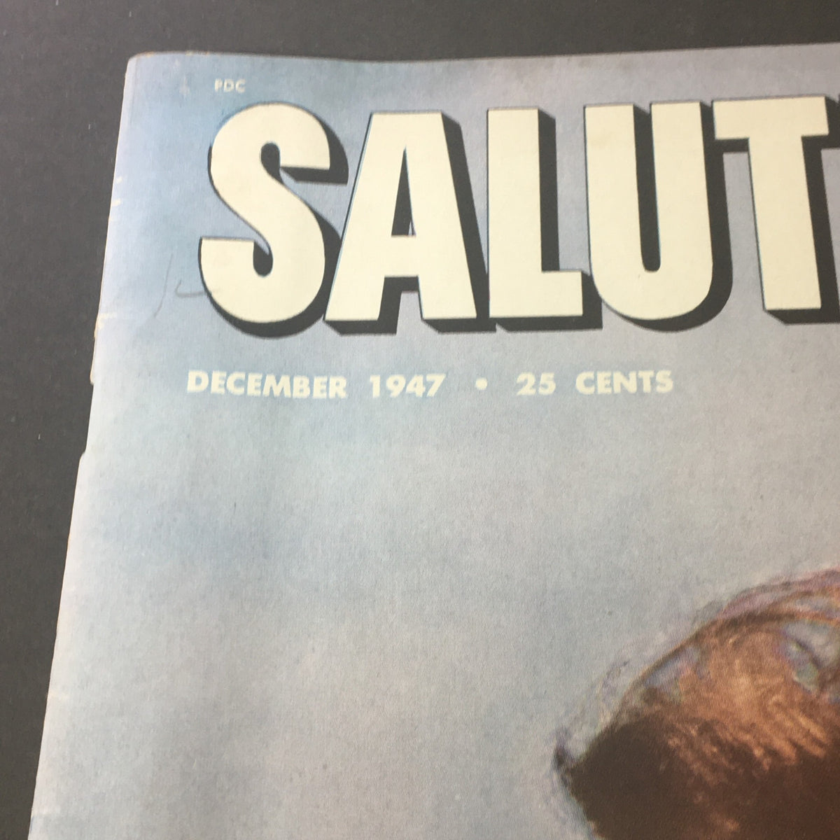 Close-up of the title of VTG Salute Magazine December 1947 showcasing the publication date and price, revealing the vintage design elements.