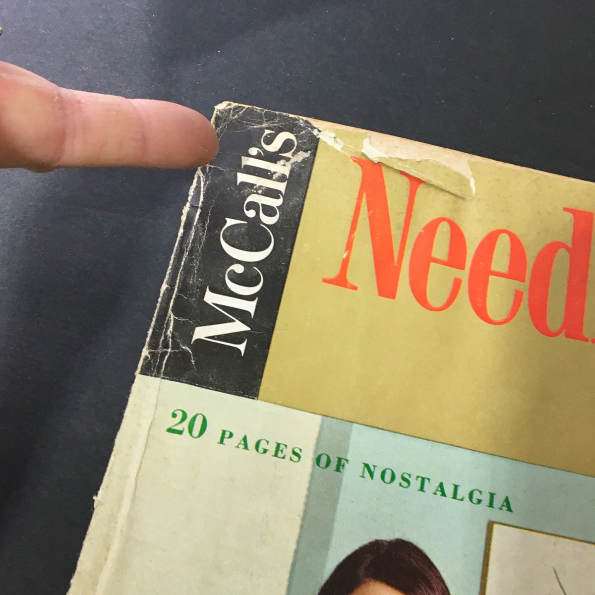 Close-up of the VTG McCall's Needlework & Crafts Magazine Spring Summer 1969, highlighting the magazine title with visible wear on the cover.