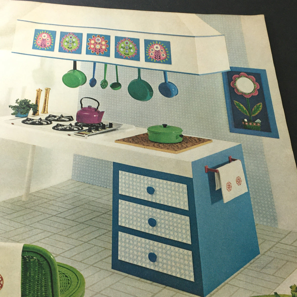 Charming kitchen scene featured in VTG McCall's Needlework & Crafts Magazine Spring Summer 1969, illustrating a joyful use of colors and floral patterns for home decoration.