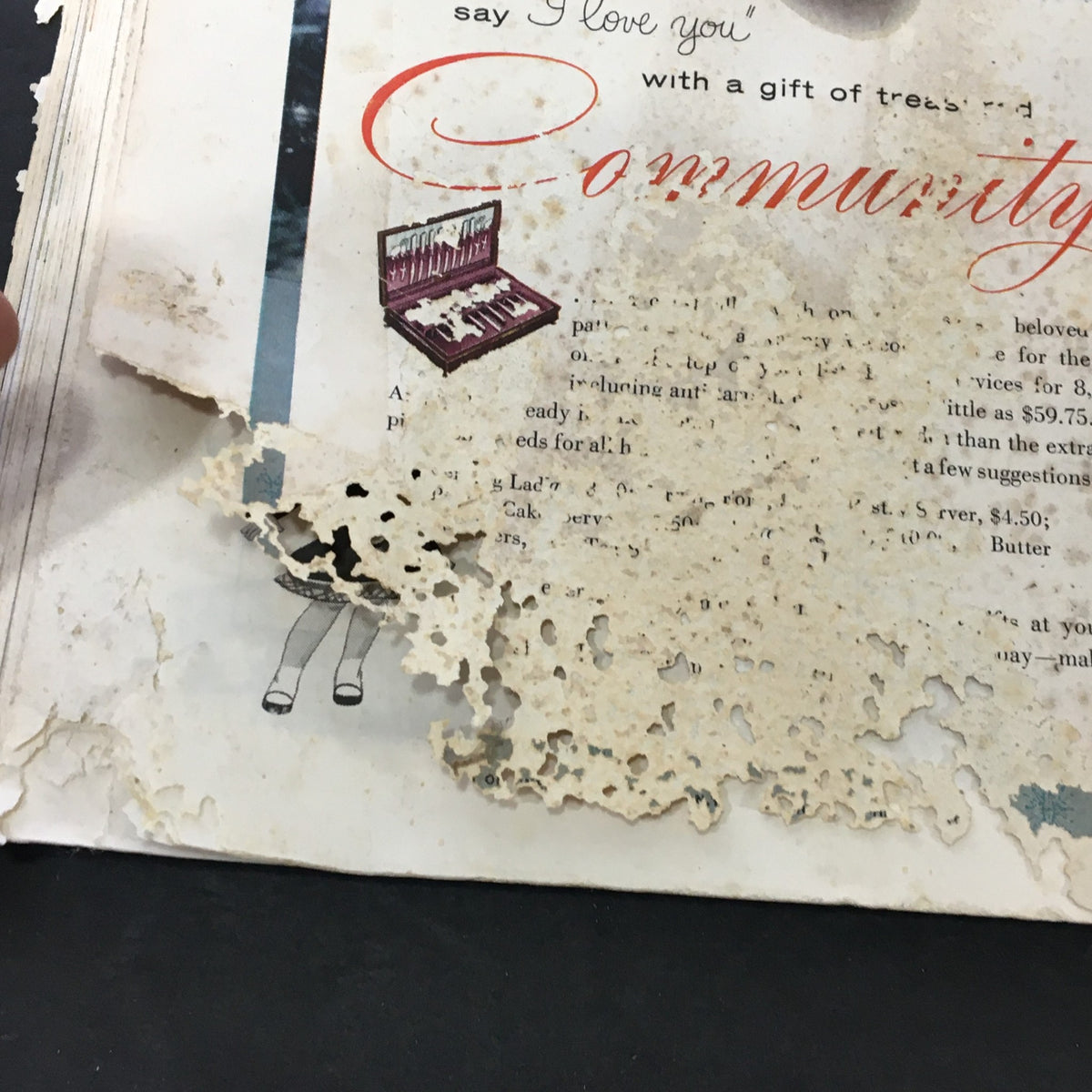 Close-up of the VTG Journal Magazine December 1954 cover, highlighting an advertisement for Community silverware with visible wear and tear, reflecting its vintage character.