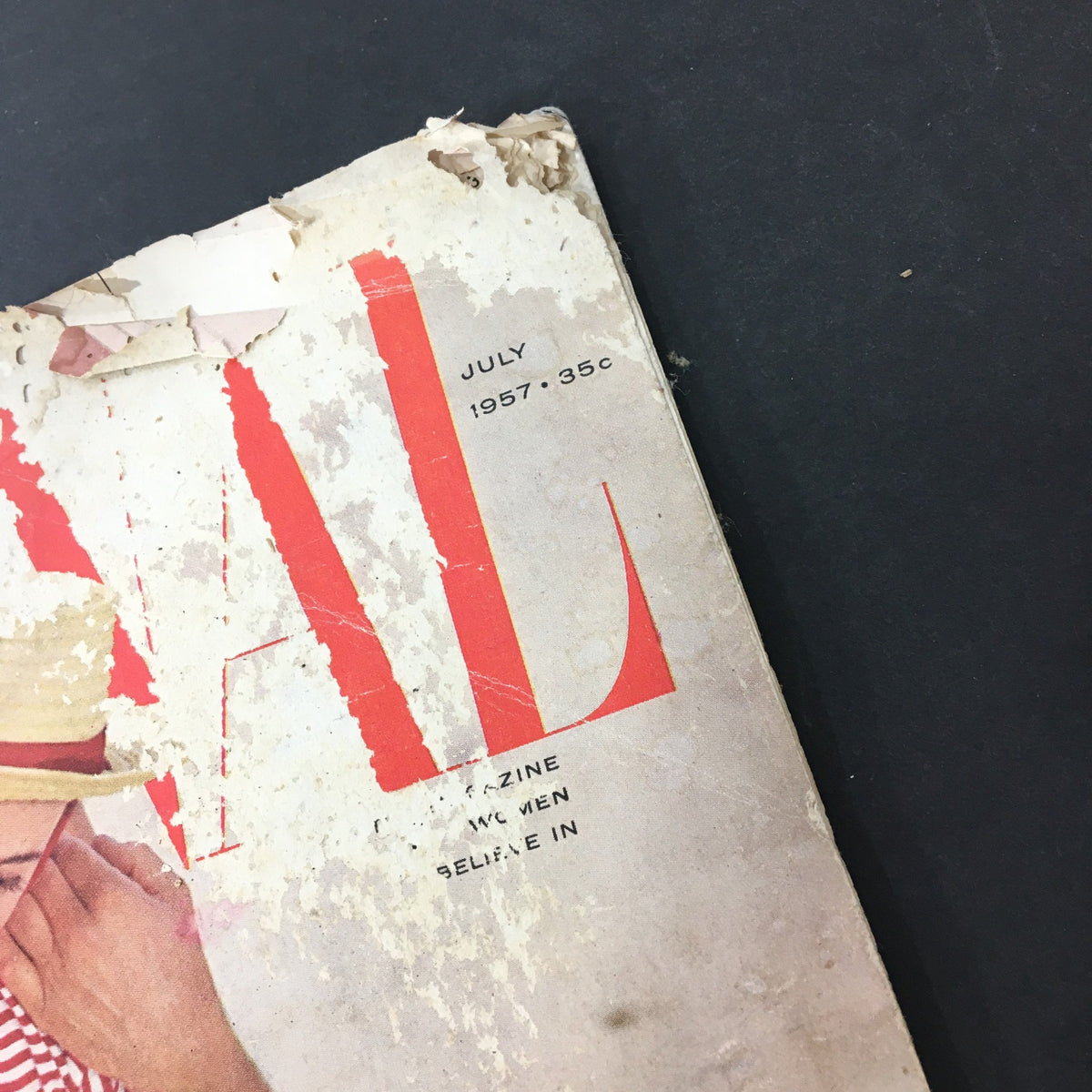 Close-up of the vintage Journal Magazine July 1957, highlighting the magazine's title and publication date, reflecting its charm and nostalgic value.