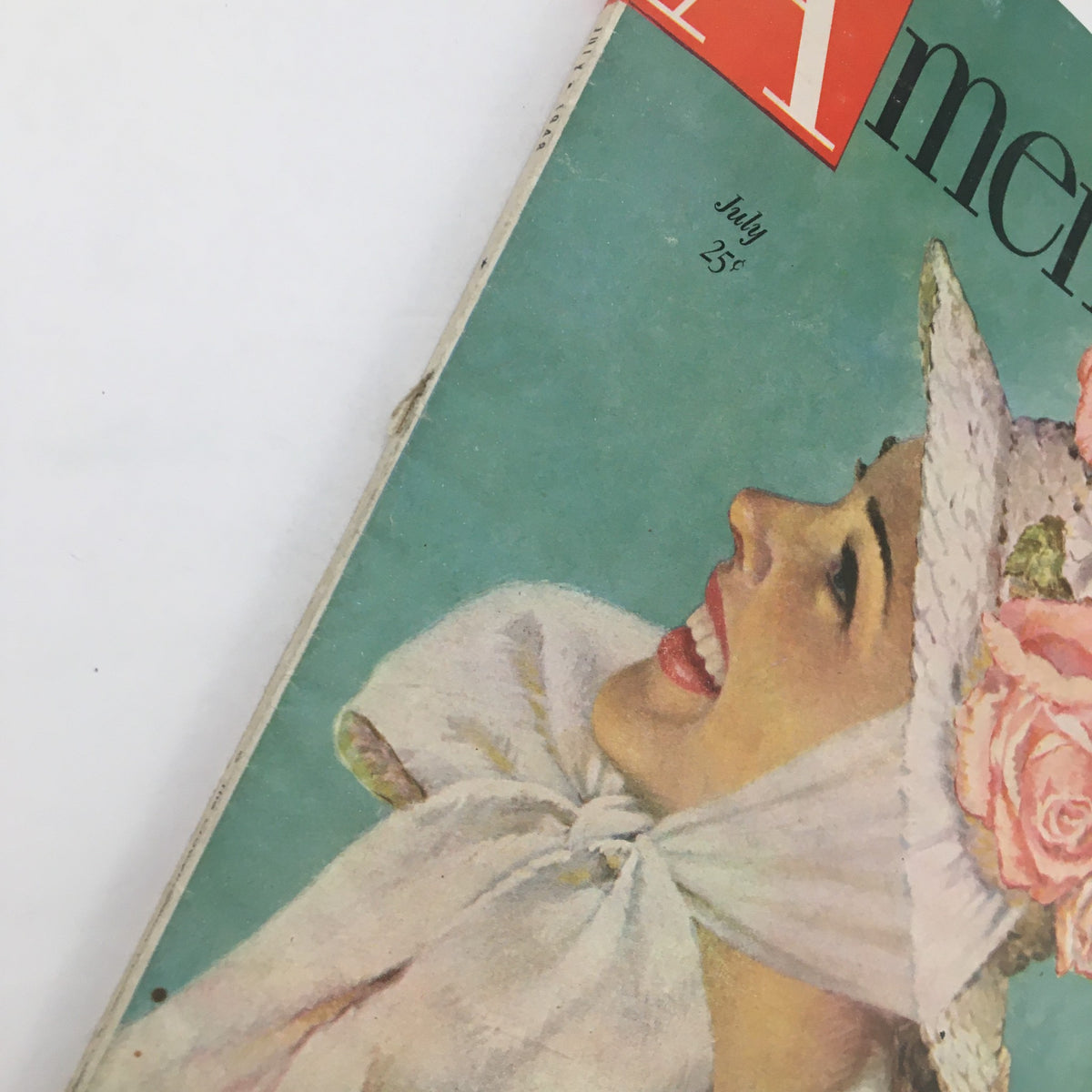 Close-up of the cover of The American Magazine July 1948 emphasizing the smiling woman and the magazine's title.