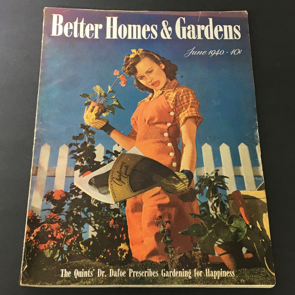 Cover of VTG Better Homes & Gardens June 1940 featuring gardening advice from Dr. Dafoe, showcasing a woman in a garden holding plants and a gardening tool.