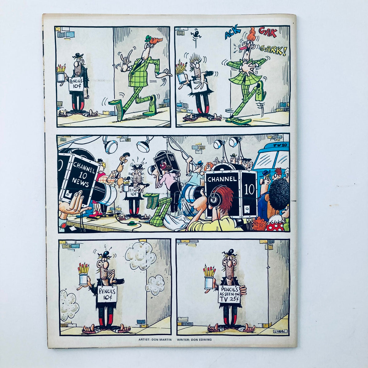 Back cover of VTG Mad Magazine January 1982 with colorful cartoon illustrations by Don Martin. It humorously depicts characters with pencils, showcasing the magazine's signature comedic style.