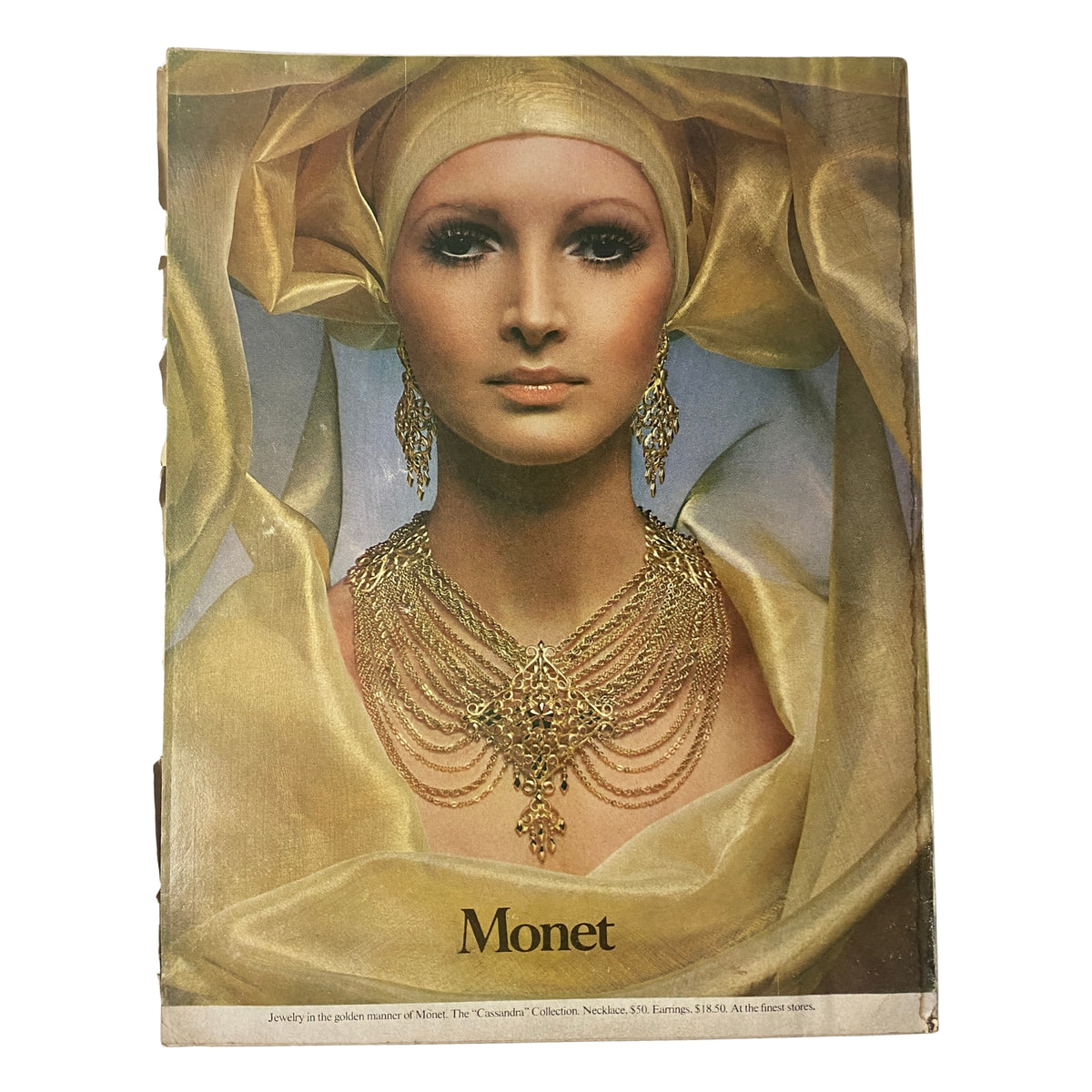 Cover of Vogue Magazine September 15, 1969 featuring luxurious jewelry against a model in a gold ensemble, encapsulating the glamour and elegance of late 1960s fashion.