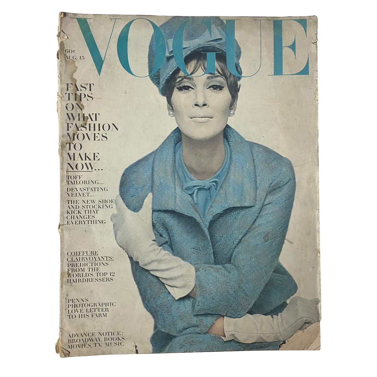 Vogue Magazine August 15, 1963 cover featuring a woman in a blue outfit with white gloves, showcasing fashion tips and styling innovations.