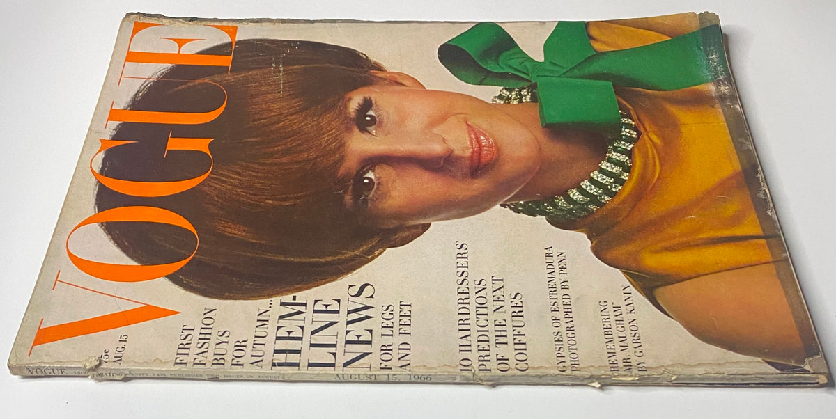 Vogue Magazine cover dated August 15, 1966, showcasing Brigitte Bauer in a fashionable yellow dress adorned with a green bow, with headlines on fashion buys and trends for the autumn season.