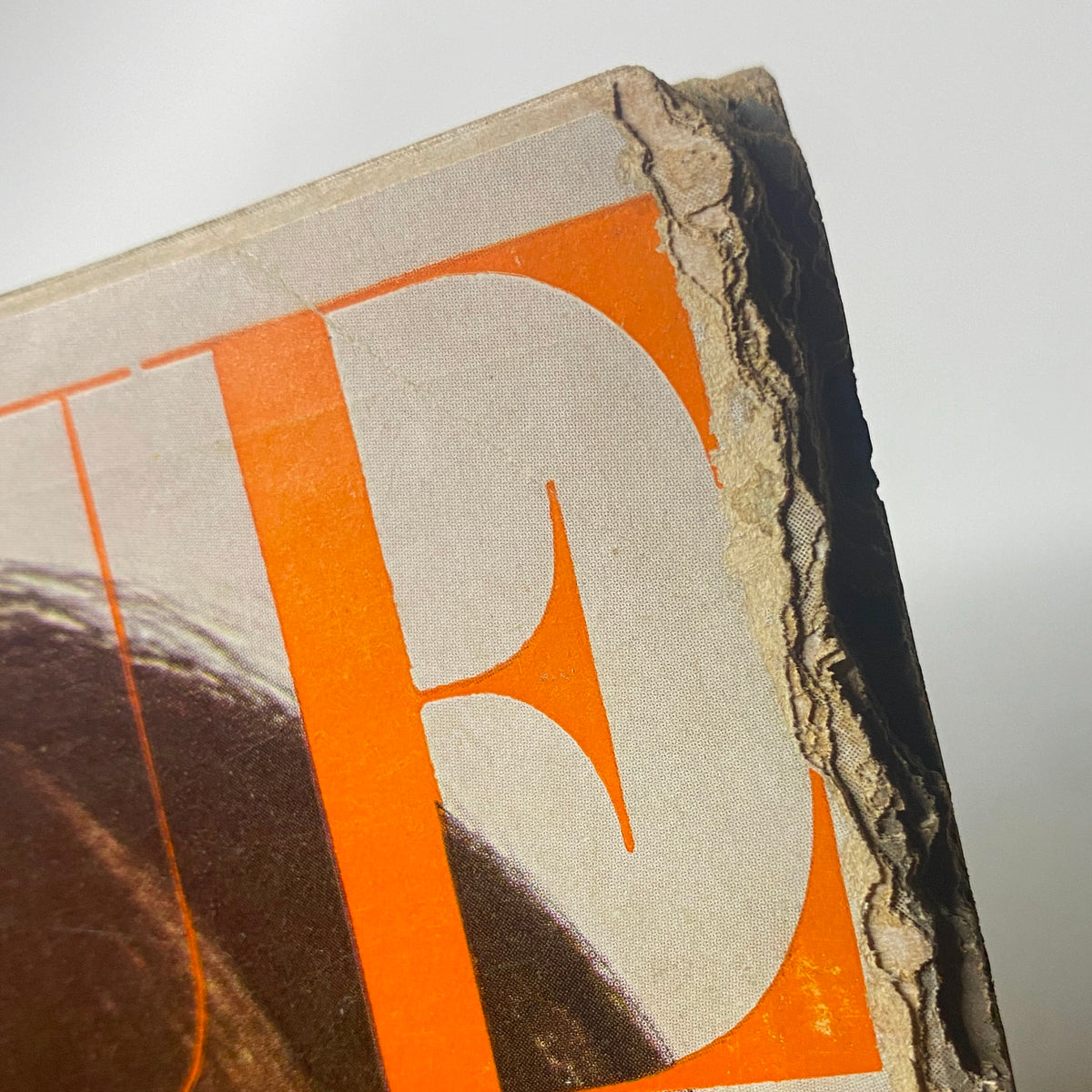 Close-up of the damaged corner of the Vogue Magazine cover from August 15, 1966, featuring Brigitte Bauer, highlighting the magazine’s vintage condition with signs of wear.