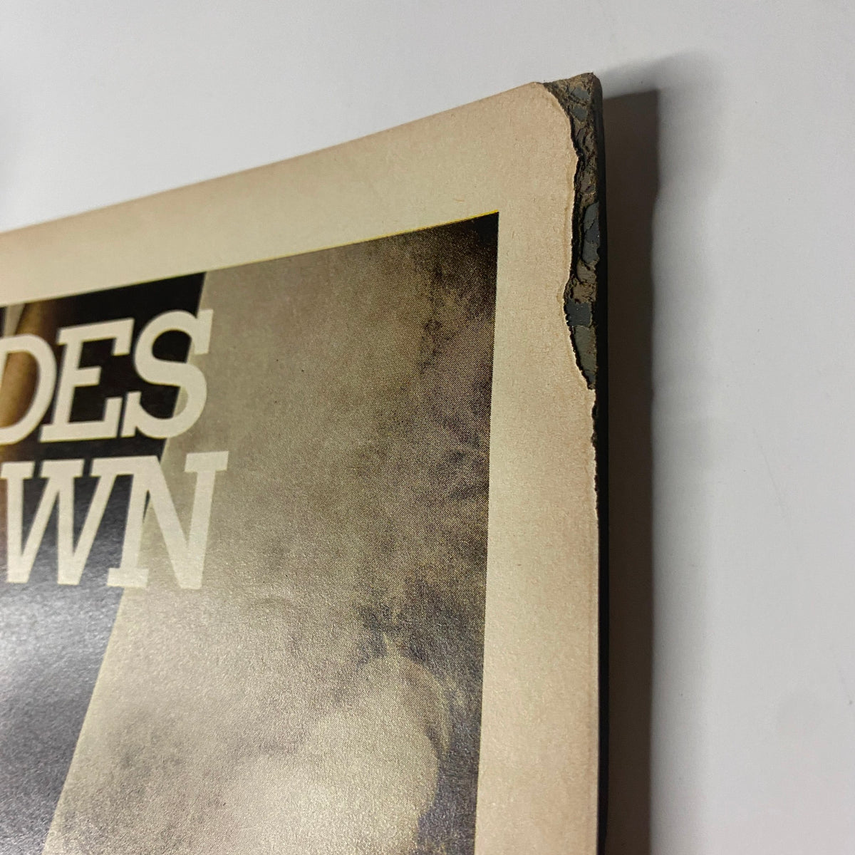 Close-up of the cover damage of Vogue Magazine August 15, 1966, showcasing worn edges and signs of aging, important for collectors.