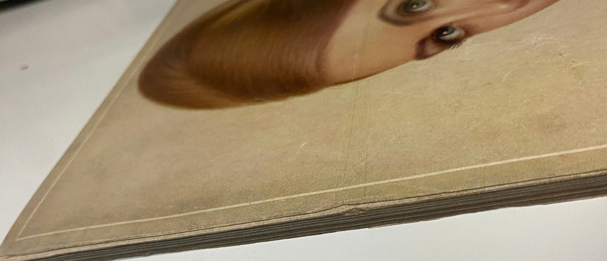 Detailed shot of the edge of a vintage Vogue Magazine from August 15, 1966 showcasing the cover by Irving Penn featuring Brigitte Bauer, with visible aging and subtle wear marks.