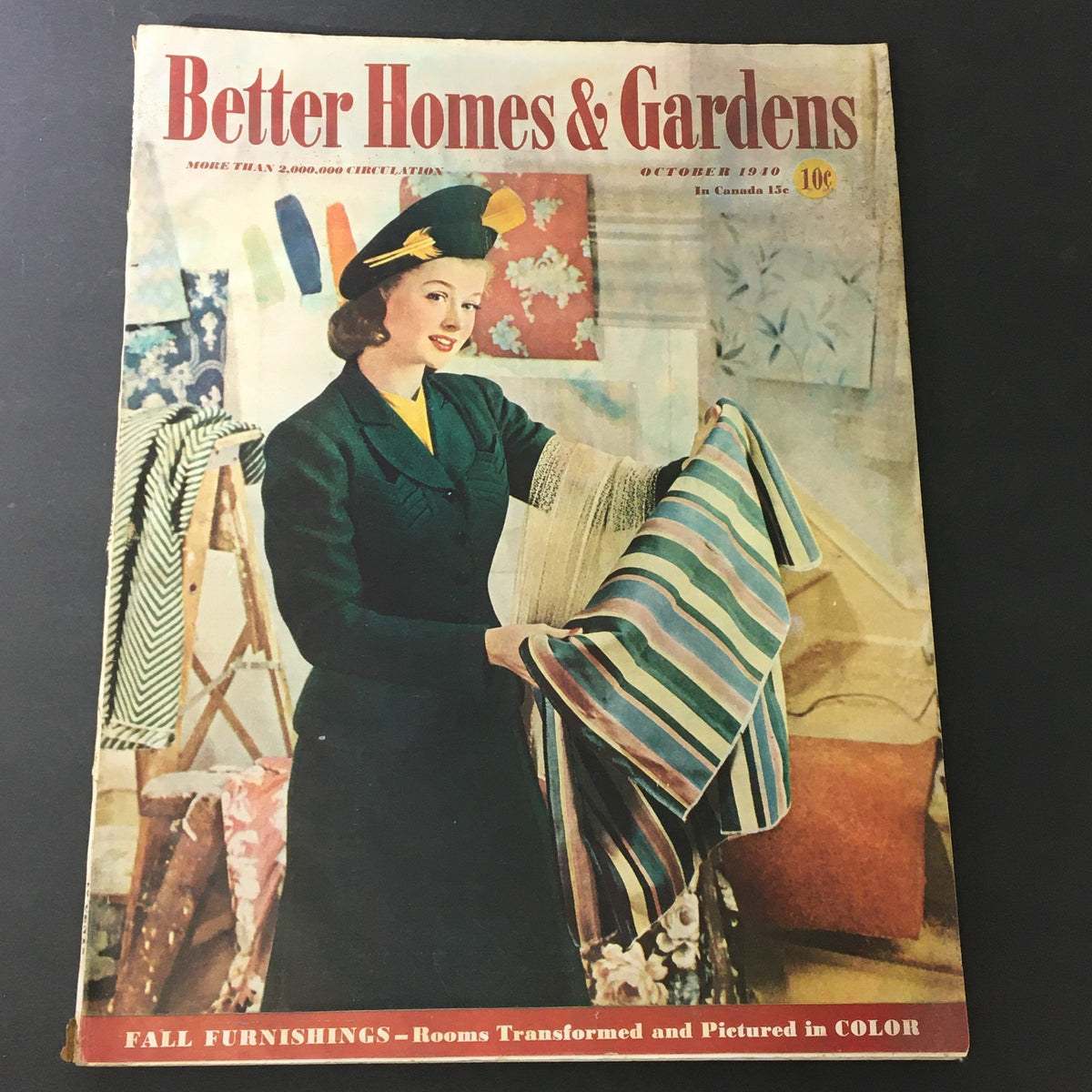 Cover of VTG Better Homes & Gardens October 1940 Vol 19 #2 showcasing a woman dressed in vintage style holding striped fabric, highlighting practical advice for solving window problems.