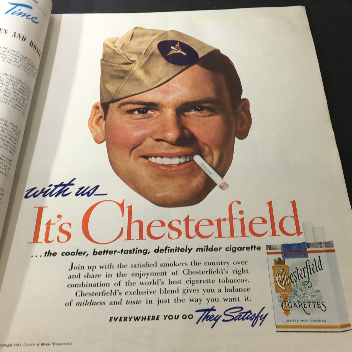 Advertisement page in VTG Better Homes & Gardens July 1941 featuring a smiling soldier promoting Chesterfield cigarettes, with brand information and graphics.