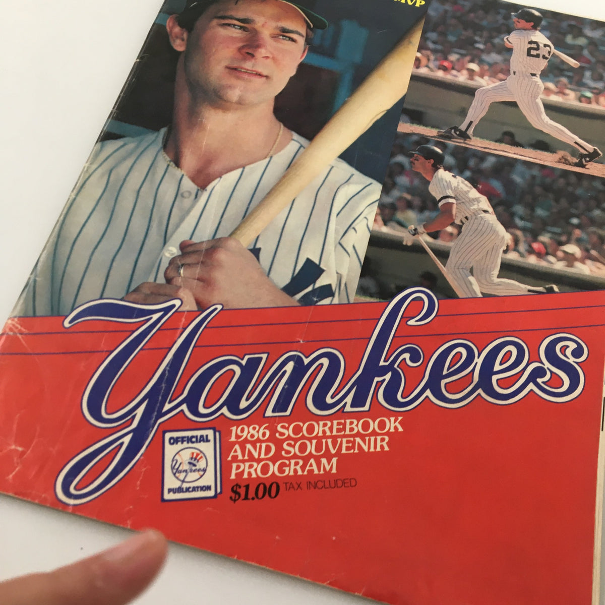 Close-up of the 1986 Official Scorebook & Souvenir Program cover for MLB New York Yankees, displaying Don Mattingly's image and the program's title.