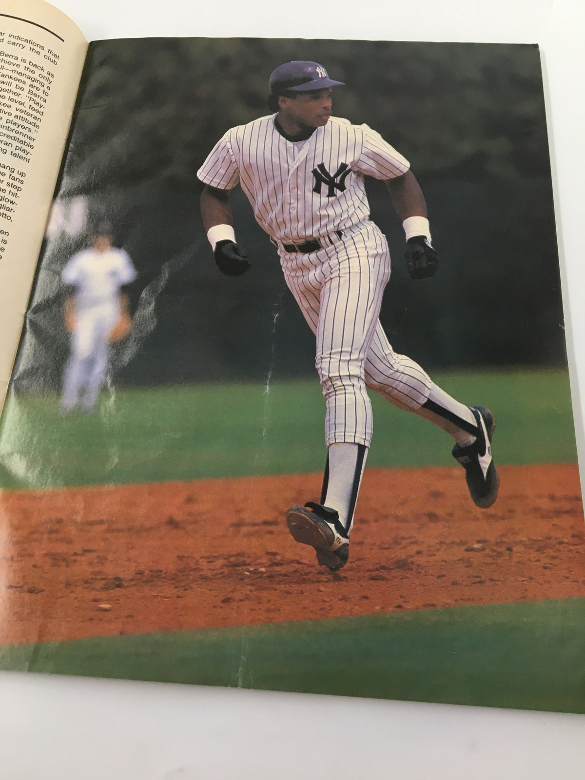 Color photograph of Yankees player Ricky Henderson in action, featured in Vintage Yankees Magazine May 9 1985. The image highlights Henderson's dynamic playing style.