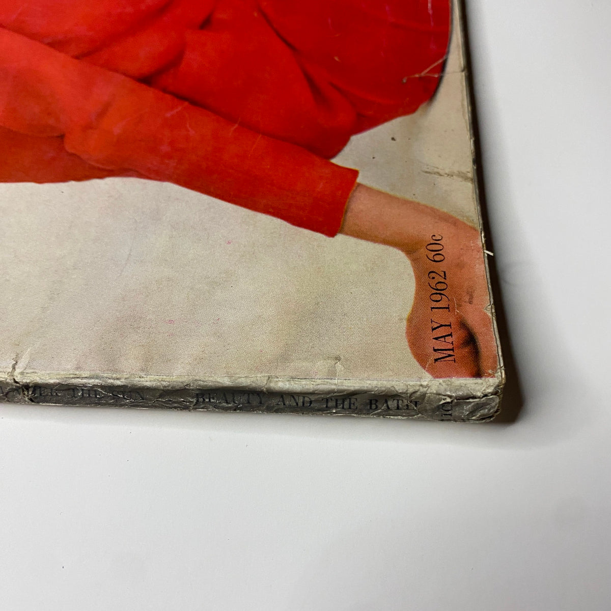 Cover of Harper's Bazaar Magazine May 1962 featuring a fashion model in vibrant red attire, photographed by Richard Avedon, showcasing early 1960s summer fashion.