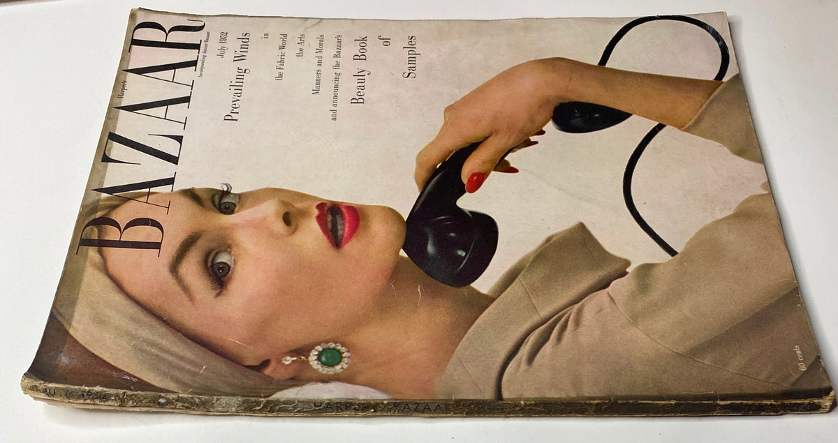 Close-up view of the July 1952 Harper's Bazaar Magazine cover with Georgia Hamilton, captured by Richard Avedon, highlighting the model's elegant look and vintage styling, along with the magazine's iconic title and tagline.