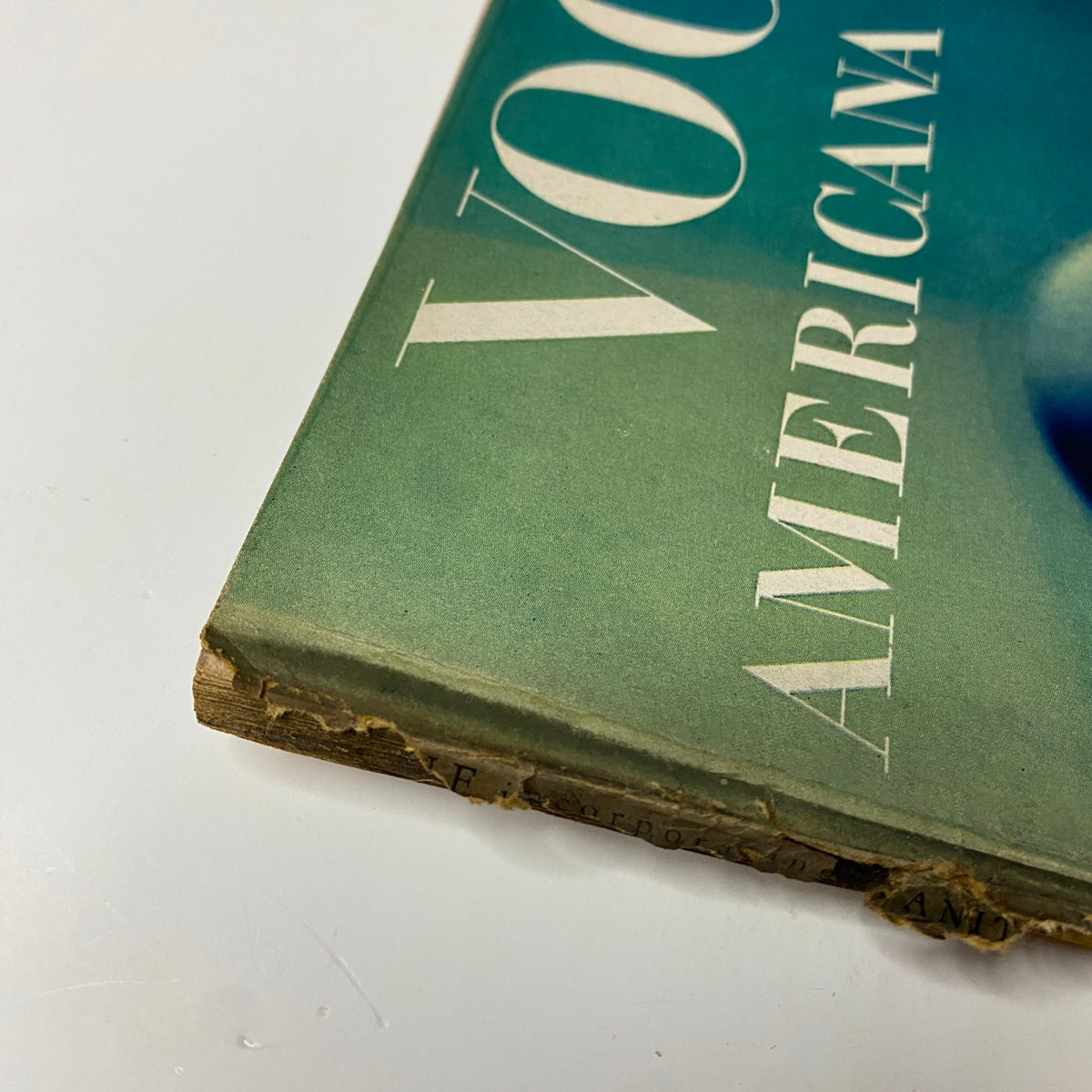Close-up image of the corner of Vogue Magazine February 1, 1944 Americana Number by Irving Penn showing wear and age on the spine.