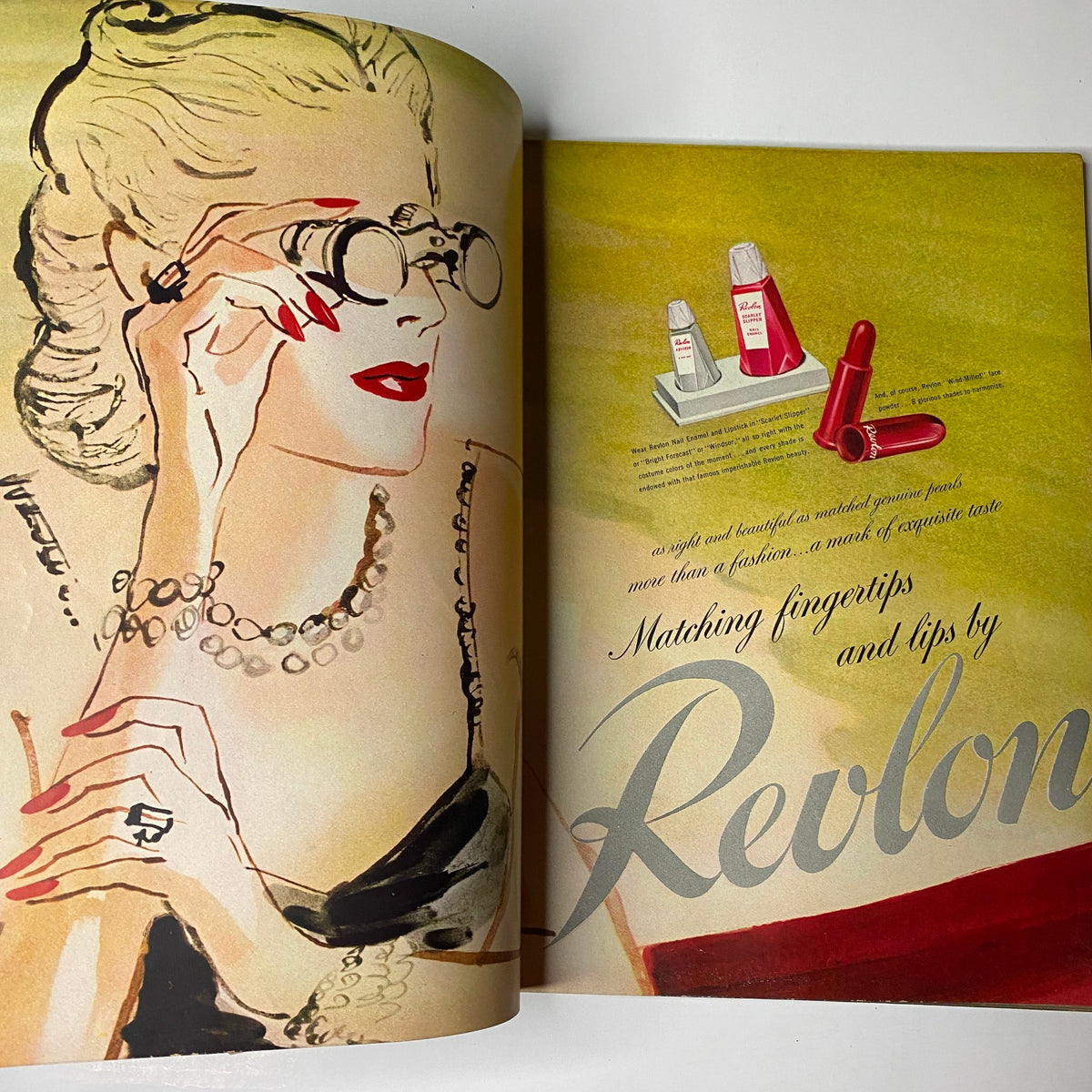 Stylized beauty advertisement from Vogue Magazine February 1, 1944 Americana Number by Revlon, featuring glamorous lipstick and cosmetics.