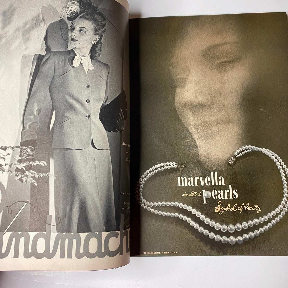 Inside view of Vogue Magazine February 1, 1944 Americana Number by Irving Penn, featuring a fashion model in a vintage suit and marvella pearls advertisement, showcasing mid-century American style.