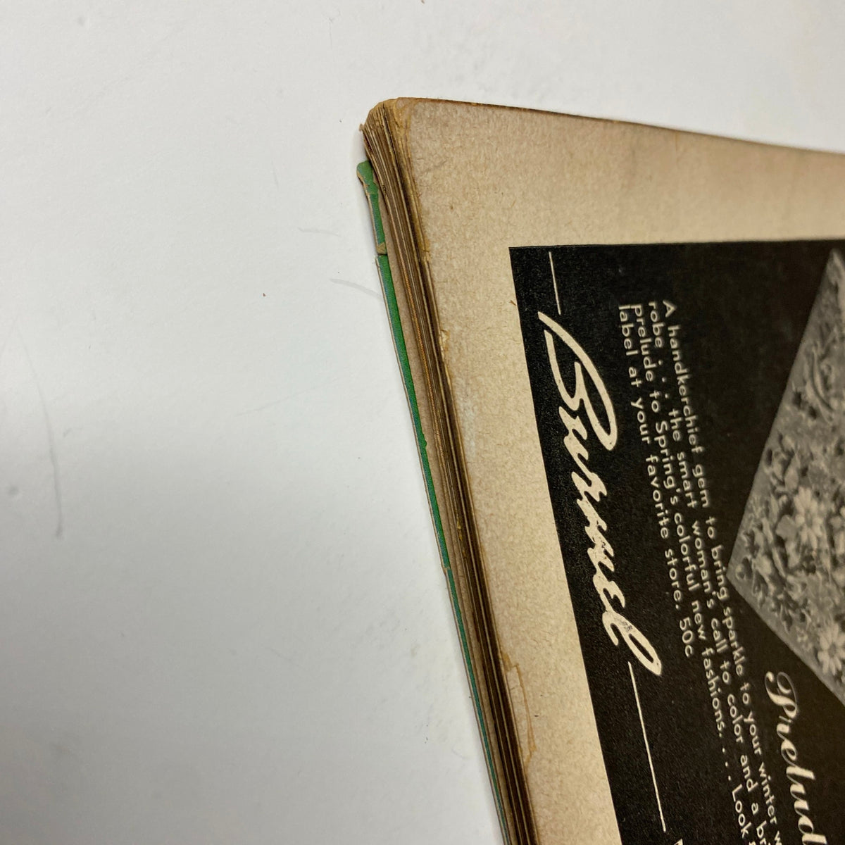 Close-up of the spine of Vogue Magazine February 1, 1944 Americana Number by Irving Penn, showing the condition of the binding and vintage wear typical of this era.