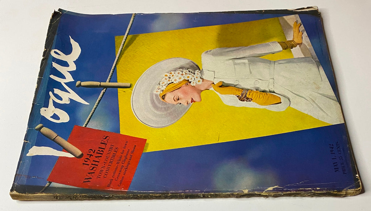 Vogue Magazine May 1, 1942 with a cover image of Dana Jenney, captured by John Rawlings. The design highlights the model wearing a chic white ensemble and complementing accessories, encapsulating the vintage style of the era.