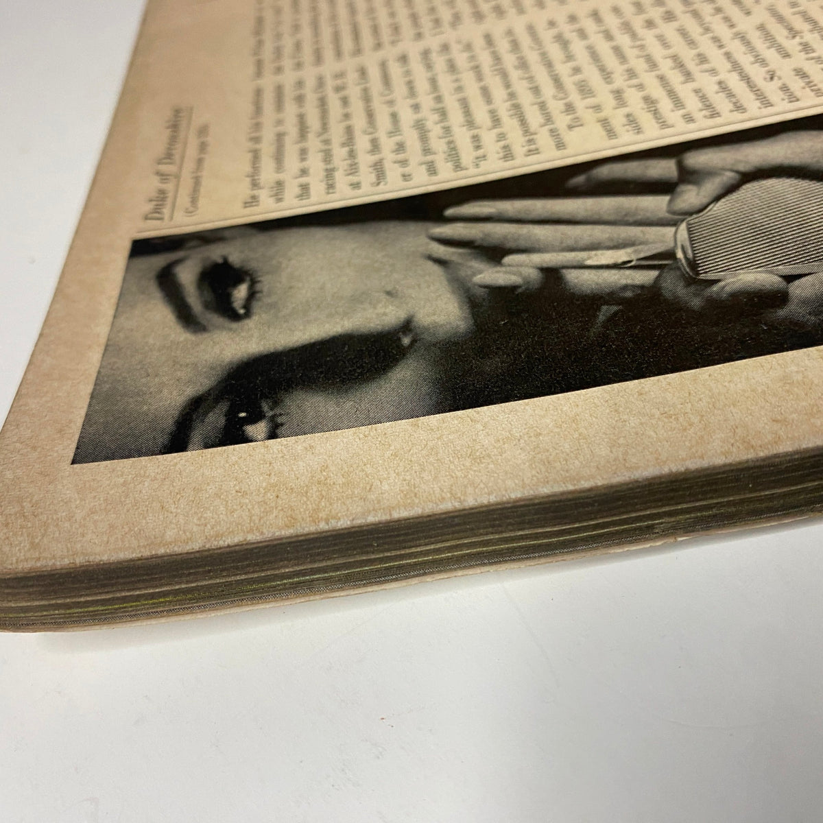 Close-up of an interior page from Vogue Magazine November 1, 1965 featuring Brigitte Bauer on the cover by Irving Penn, highlighting detailed text and aesthetic aging.