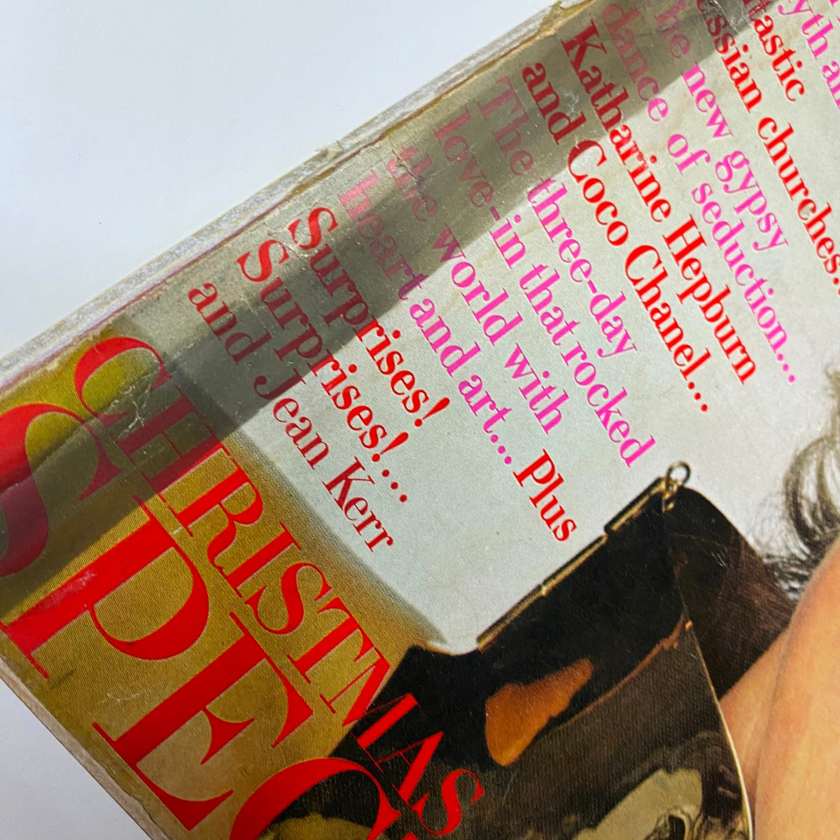 Close-up view of the cover of Vogue Magazine December 1969 featuring the text 'Christmas Spectacular' highlighting artistic articles and advertisements. Cover artwork includes a photo of a model wearing fashionable attire, by Irving Penn.